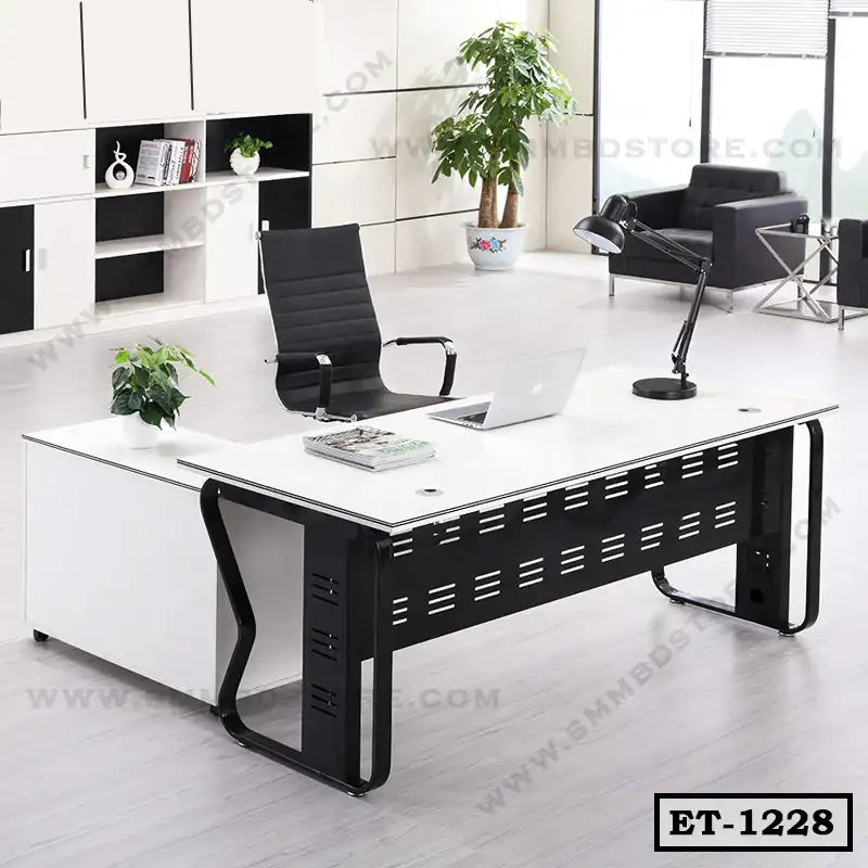 Modern executive office table with black and white finish, ergonomic chair and minimalist decor