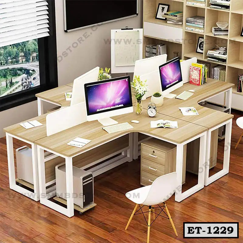 Modern executive office workstation table with wood finish, partition panels, and computers