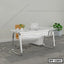 Modern white executive office table with metal legs, swivel chair, and indoor plants