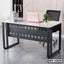 Modern executive office table with metal frame and white top, paired with a black office chair
