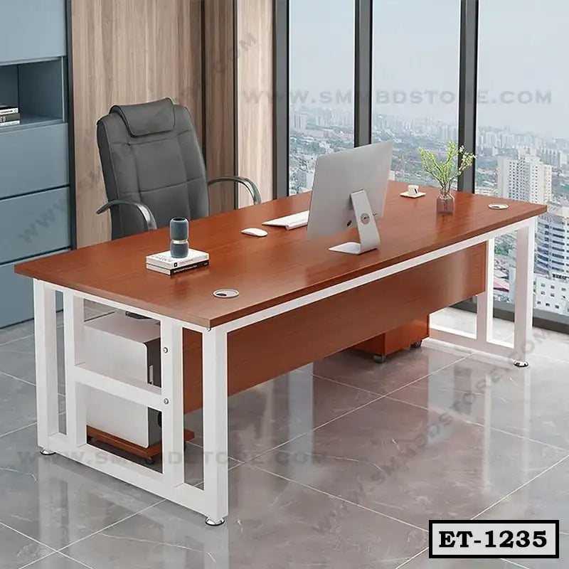 Modern executive office table with metal frame, wooden top, and ergonomic chair by window.