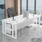 Modern white executive office desk with black chair and computer in a high-rise workspace