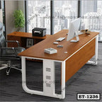 Modern executive office table with wood finish, computer, and swivel chair in a city view office