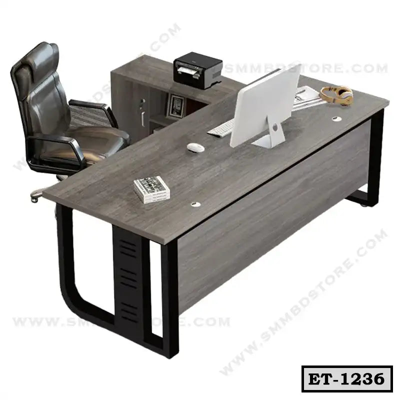 Modern executive office desk with black frame, ergonomic chair, and storage cabinet