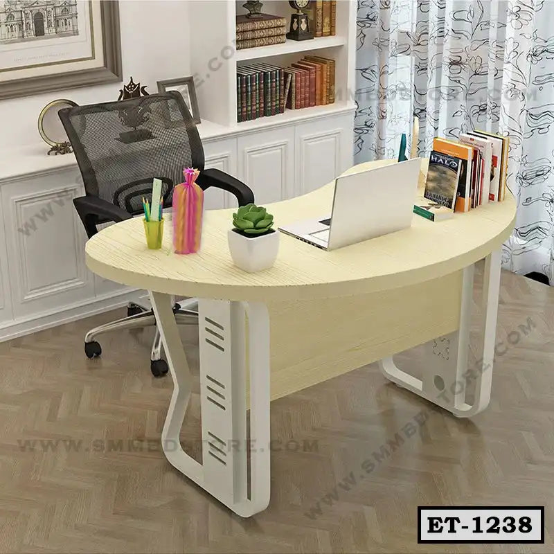 Modern executive table with laptop, books, mesh office chair, and decorative items in home office Main image
