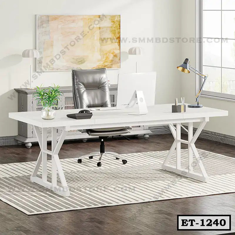 Modern white executive office table with swivel chair, desk lamp, and decor in a bright workspace