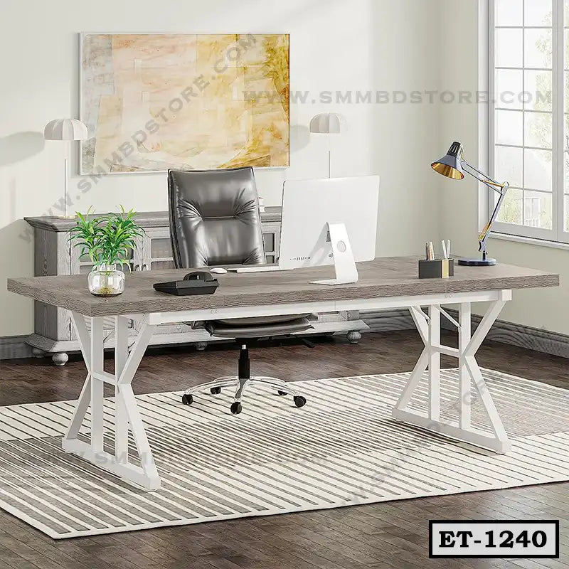 Modern executive office table with wood top, white metal legs, and ergonomic chair in bright workspace