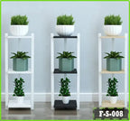 Modern three-tier plant racks with potted plants against a light wall, indoor decor display