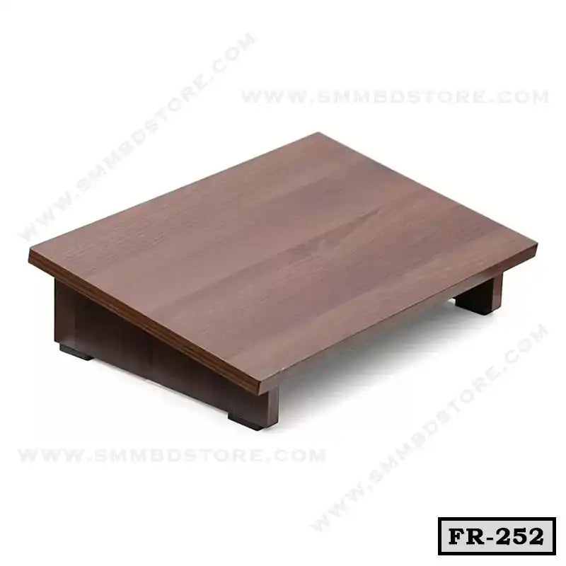 Wooden ergonomic foot rest for office or home desk, angled for comfort and support