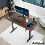 Hand crank height adjustable desk with wood top, monitor, keyboard, and workspace setup