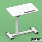 White height adjustable table with modern design and stable metal frame on green background