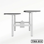 Height adjustable workstation desk frame with dual platforms and white metal legs.