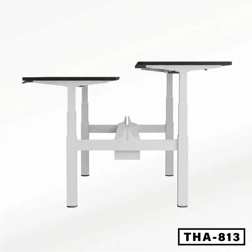Height adjustable workstation desk frame with dual platforms and white metal legs.