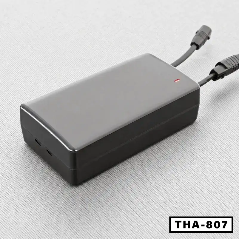 Black electric desk power adapter with indicator light and dual cables, model THA-807