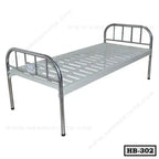 Single metal hospital bed with slatted base and stainless steel head and foot boards