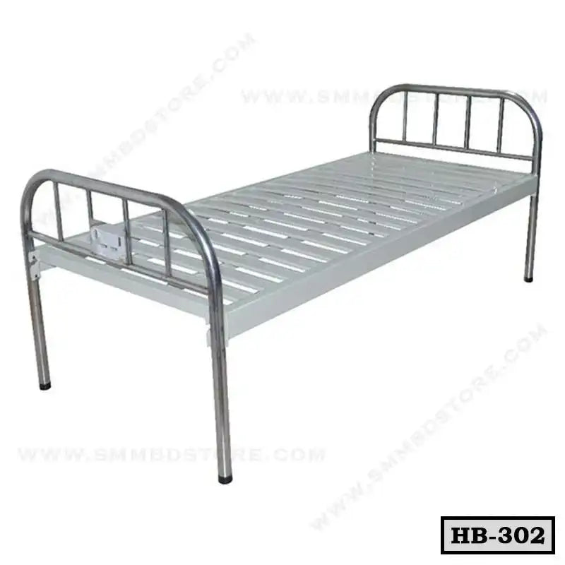 Single metal hospital bed with slatted base and stainless steel head and foot boards