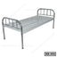 Single metal hospital bed with slatted base and stainless steel head and foot boards