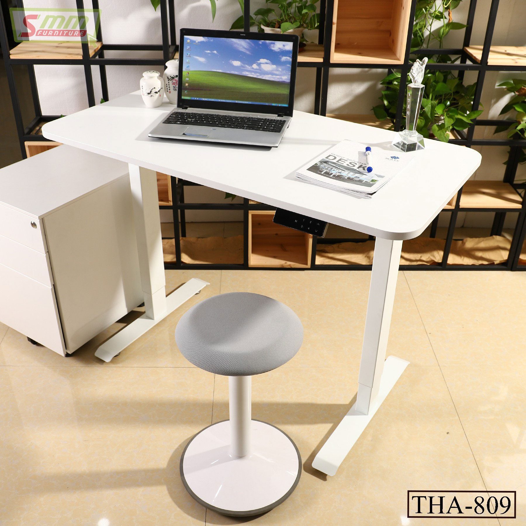 Modern white computer desk with laptop and gray stool in a home office setting Main image