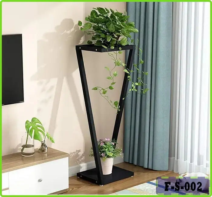 Modern indoor plant stand with two potted plants beside a window and blue curtains