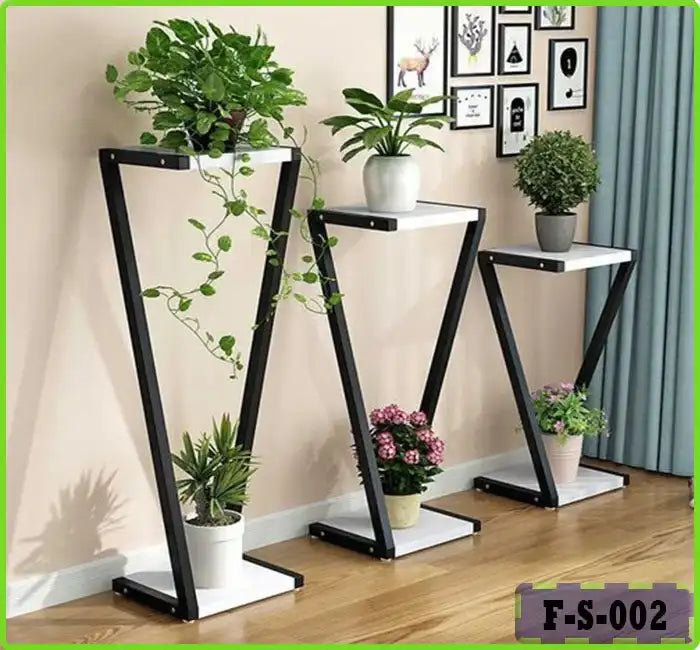 Modern indoor plant pot stand set with black metal frames, white shelves, and potted plants