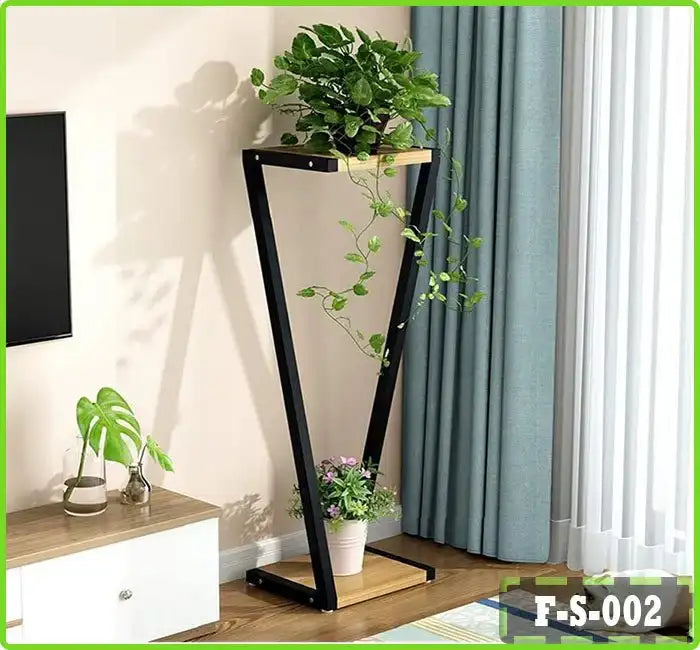 Modern indoor plant pot stand with wooden shelves and black metal frame in a living room