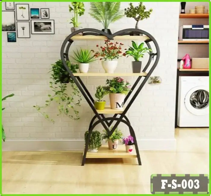 Heart-shaped metal and wood plant stand with multiple potted plants in a modern living room.