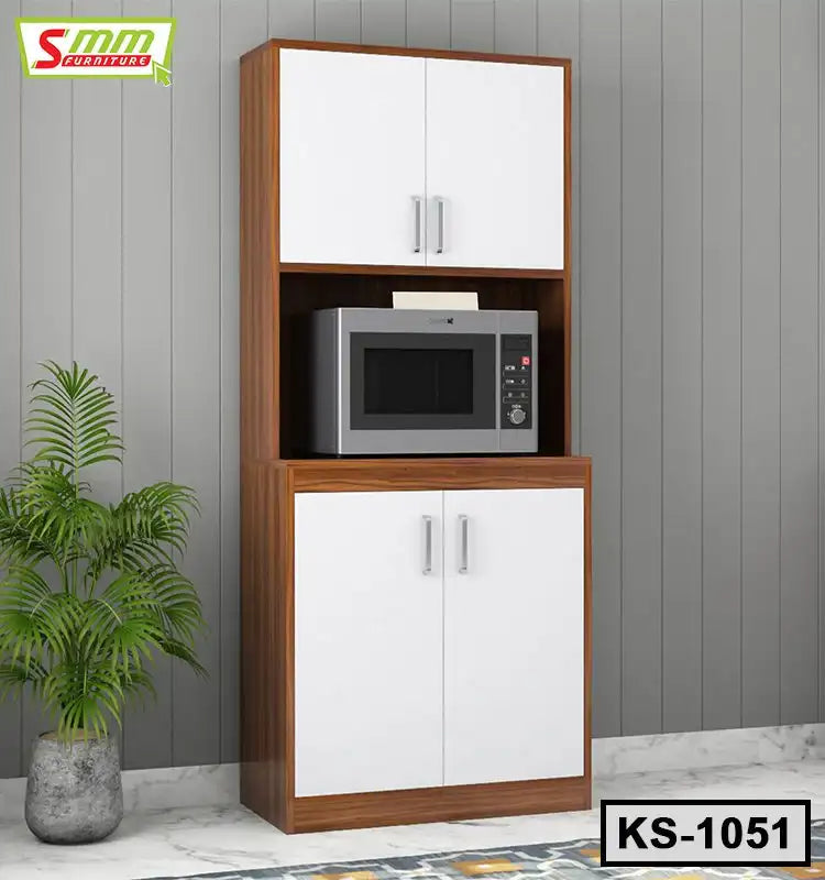 Wooden kitchen shelf with white cabinet doors, microwave shelf, and potted plant by wall Main image