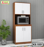 Wooden kitchen shelf with white cabinet doors, microwave shelf, and potted plant by wall