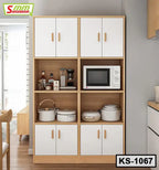 Wooden kitchen shelf with white cabinet doors, microwave, cookware, and small appliances