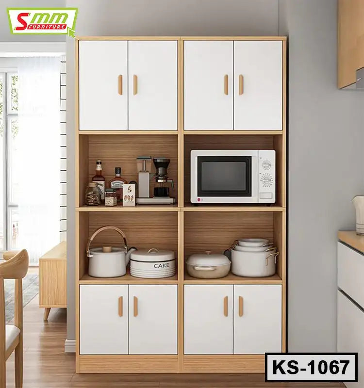 Wooden kitchen shelf with white cabinet doors, microwave, cookware, and small appliances