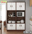Modern kitchen cabinet with white doors, shelves holding cookware, microwave, and appliances
