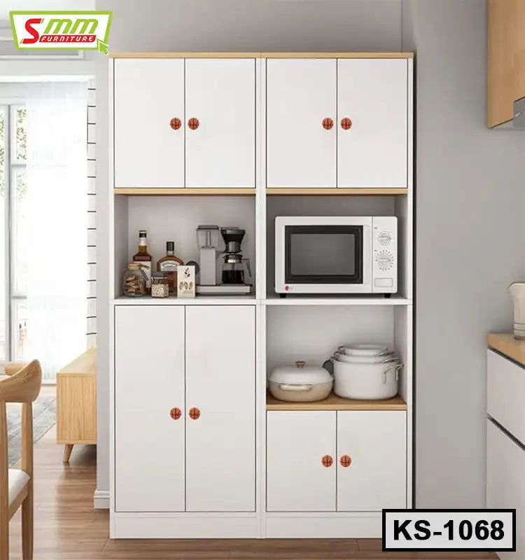 Modern white kitchen shelf with cabinets, microwave, kitchenware, and small appliances