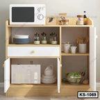 Wooden kitchen shelf with microwave, plates, jars, utensils, mugs, and vegetables