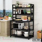 Modern black kitchen storage rack with shelves, microwave, and kitchenware in a home kitchen