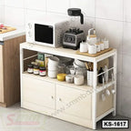 Modern kitchen shelf with microwave, blender, jars, cups, and utensils on white cabinet