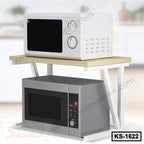 Modern kitchen shelf organizer with metal frame holding two microwaves, space-saving design.