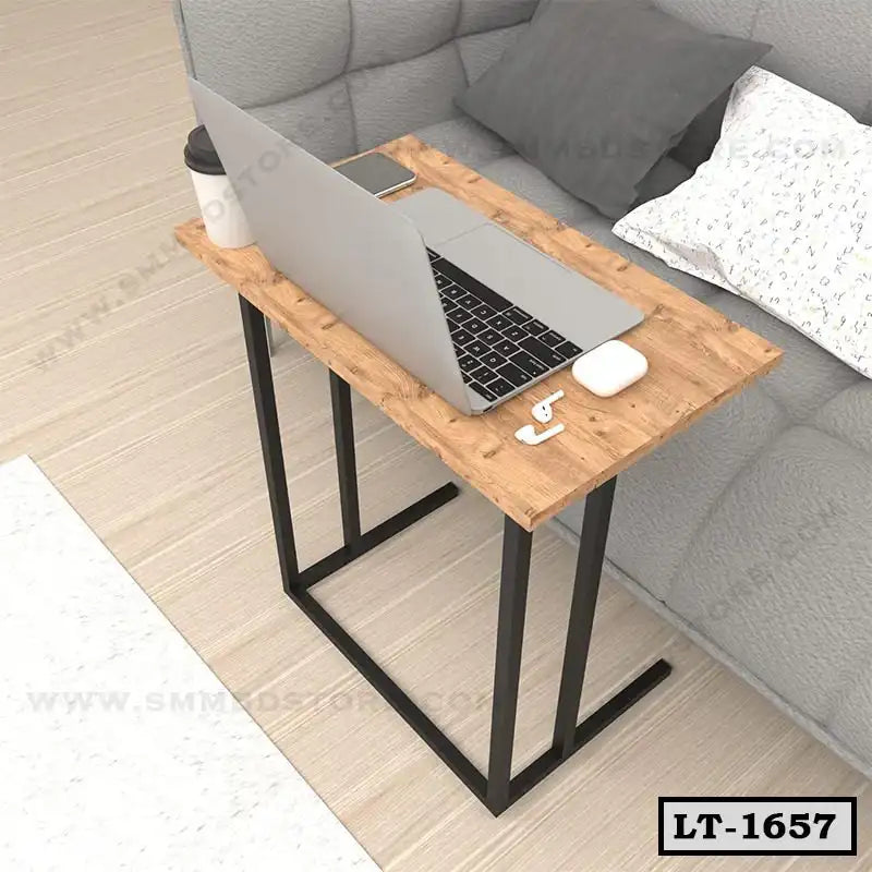 Wooden laptop table with black metal legs beside a sofa, ideal for home office setup Main image