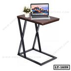 Modern wooden laptop table with black metal frame, a laptop, and a small plant on top