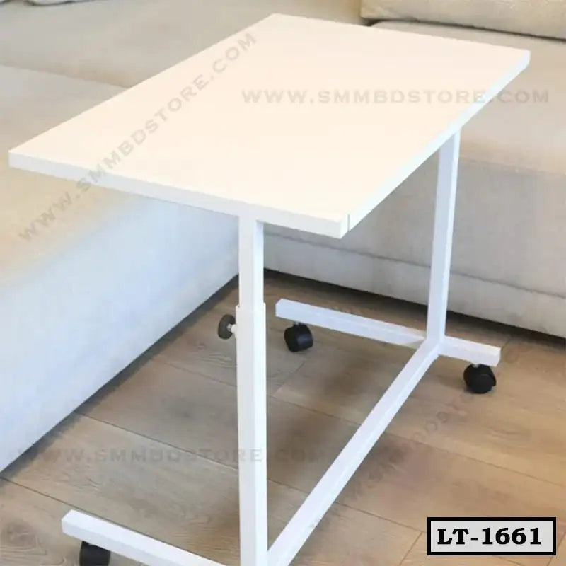 Modern white laptop table with wheels beside a sofa in a home office setting