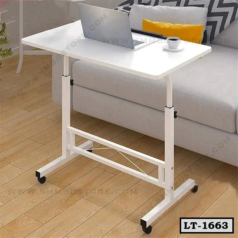 Adjustable white laptop table with wheels in front of a sofa, ideal for home office use