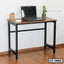 Modern laptop table with metal frame, wood top, and minimal workspace decor