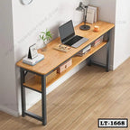 Modern wooden office desk with metal frame, laptop, books, lamp, and shelf storage