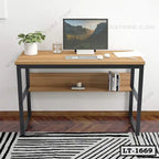 Modern wooden laptop table with metal frame, monitor, and indoor plant for home office
