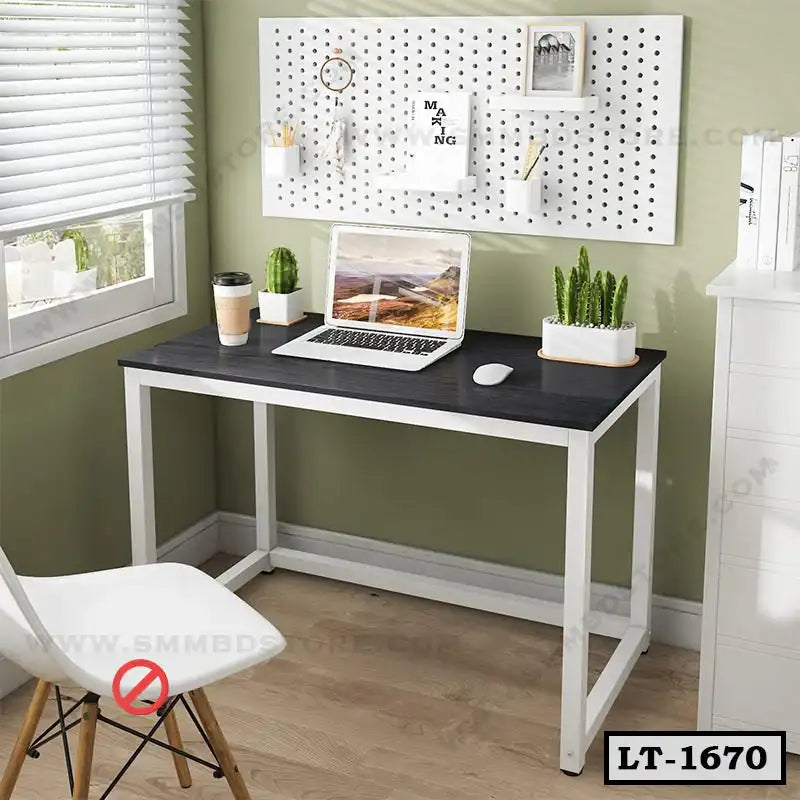 Modern minimalist laptop table with metal frame, black top, chair, and indoor plants in home office setting Main image