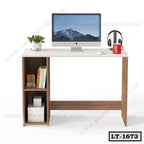 Modern wooden office desk with computer, books, mug, headphones, and decorative plant.