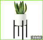 Metal flower stand with modern white planter and green snake plant, minimal design