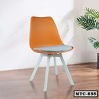 Modern orange metal tulip chair with cushion and white legs on wooden floor indoors