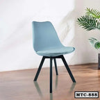 Modern metal tulip chair with blue seat and black legs on wooden floor, home interior