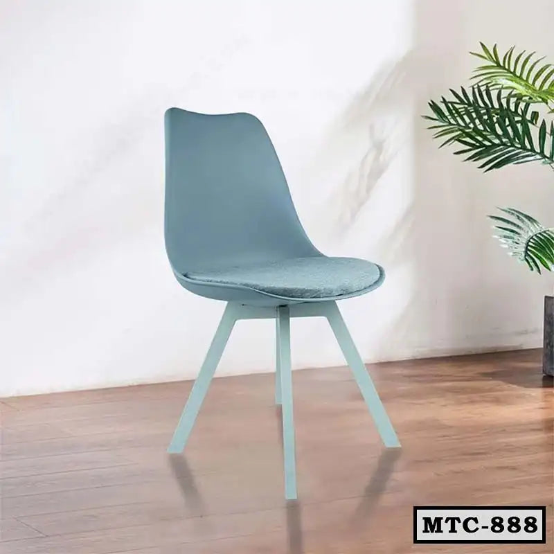 Modern metal tulip chair with cushion, light blue, on wooden floor, indoor setting