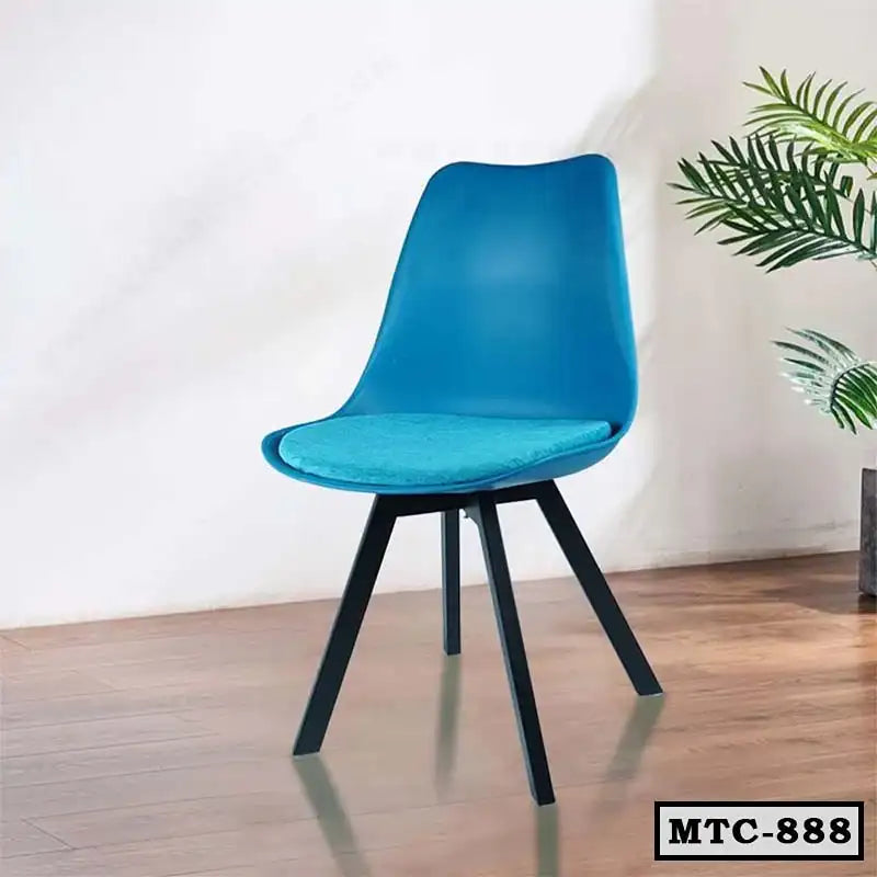 Modern blue metal tulip chair with cushion seat, black legs, on wooden floor indoors